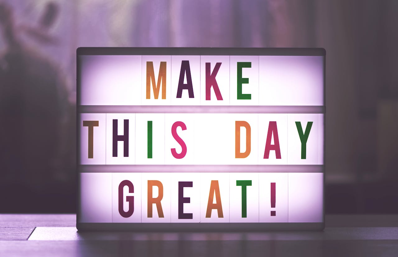 About Inspirational sign displaying 'Make This Day Great' in colorful letters.